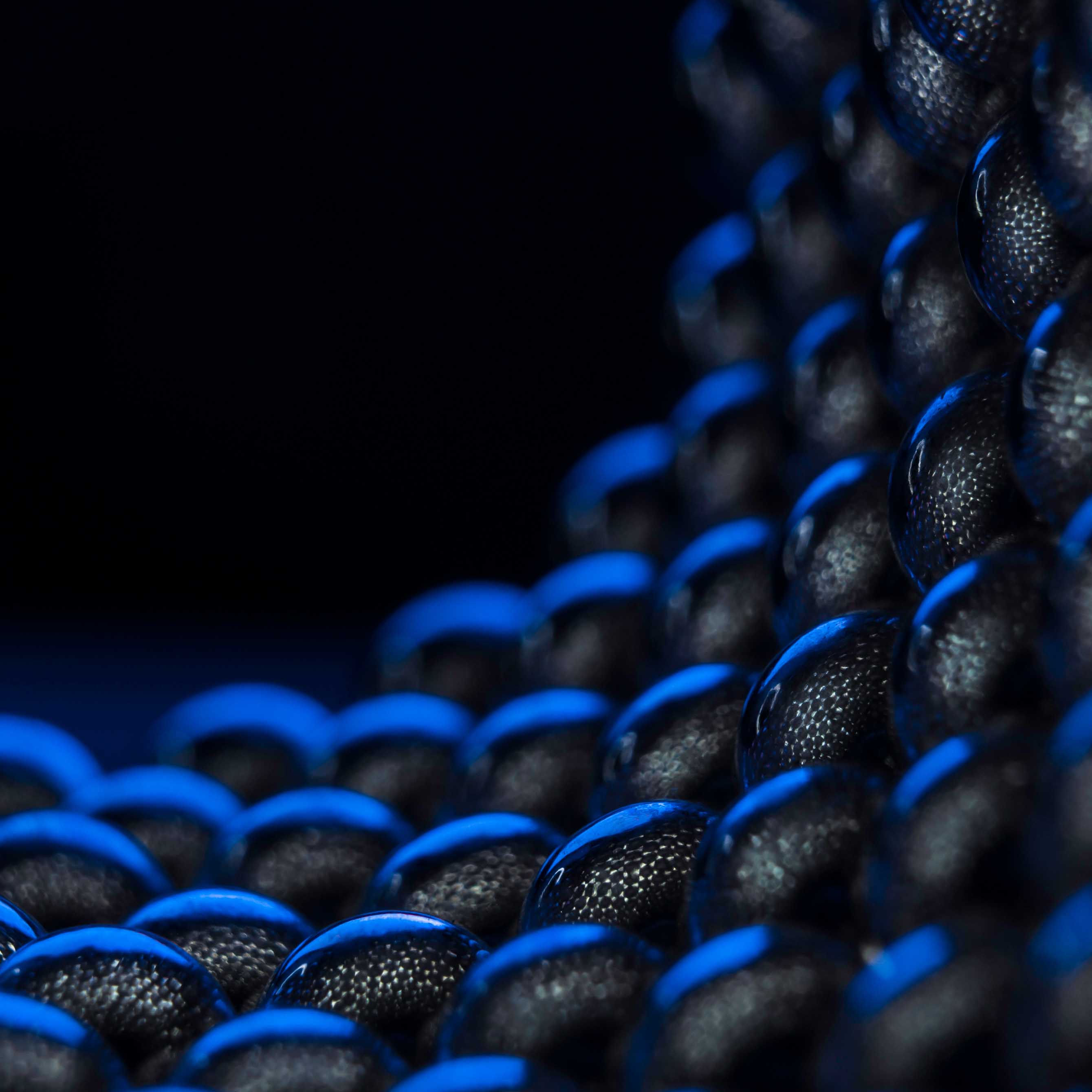stock-photo-composition-from-magnetic-metal-balls-in-blue-light-macro-close-up-1866650818-1x1