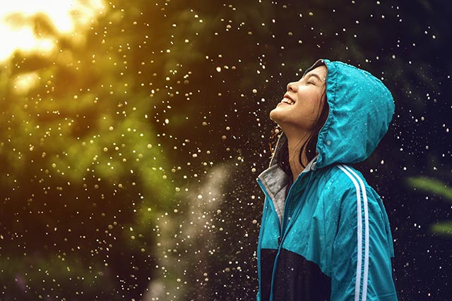 asian-woman-wearing-a-raincoat-outdoors